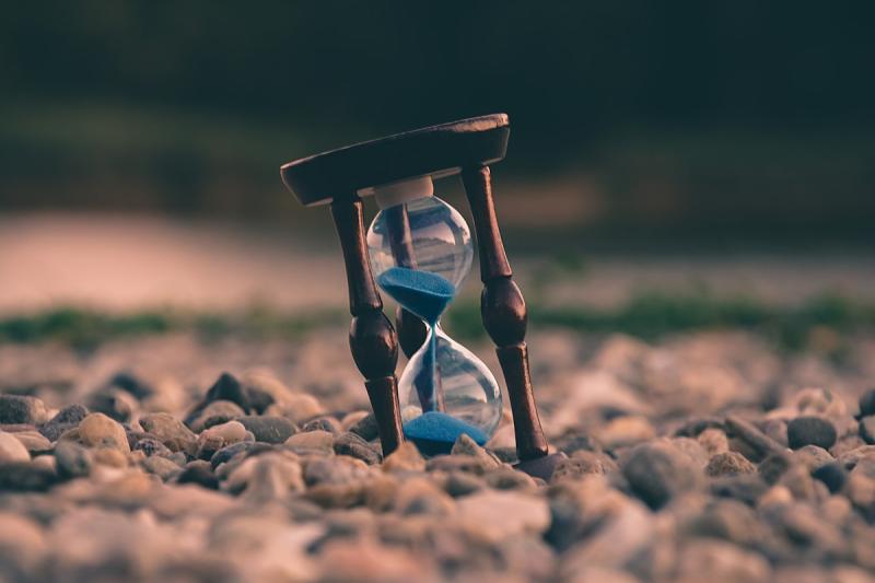 Clock surrounded by organized daily planning elements representing structured routine