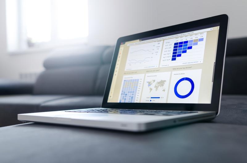 Professional analyzing data dashboards for strategic business foresight