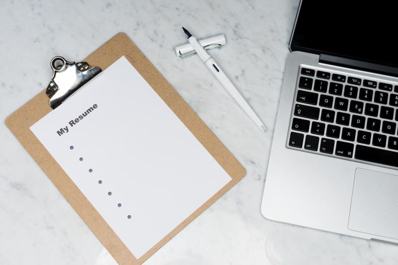 Open notebook with task lists, sticky notes, and planning materials